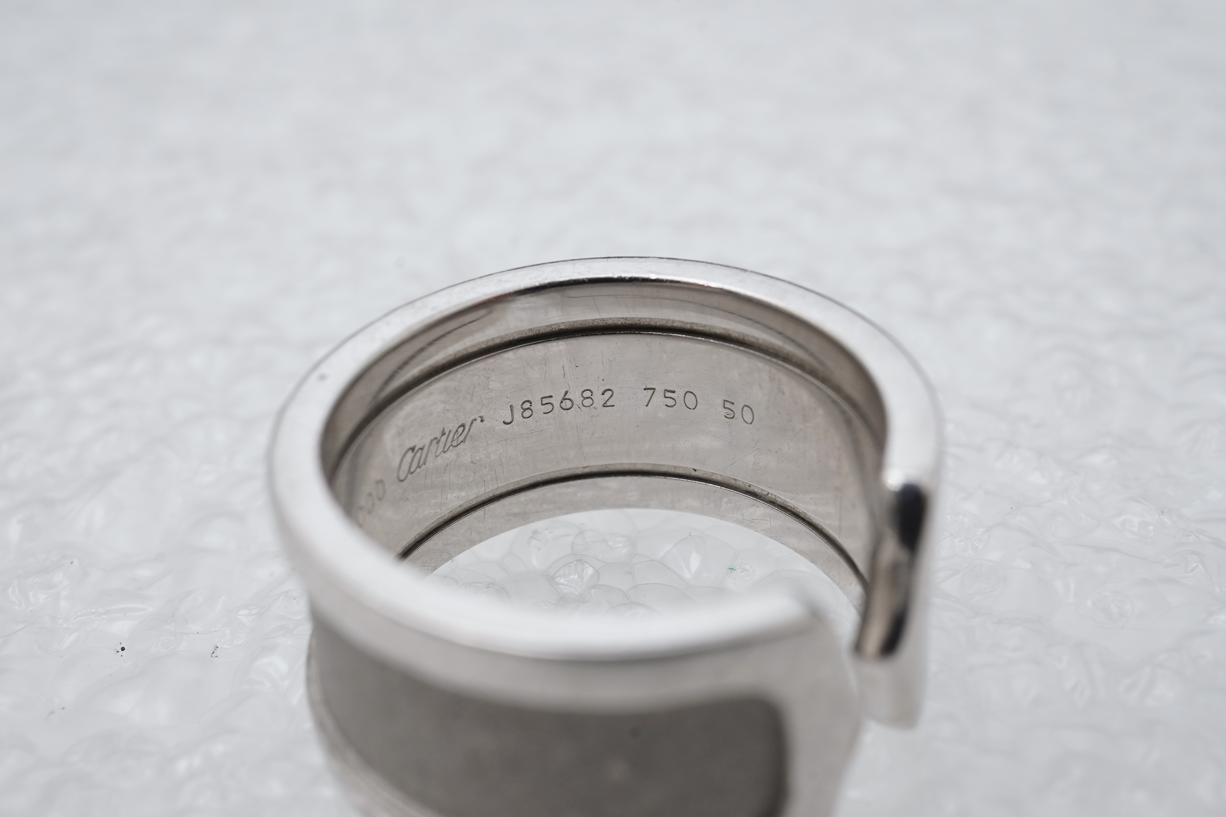 Cartier, a white gold ring, 'C de Cartier', circa 2000